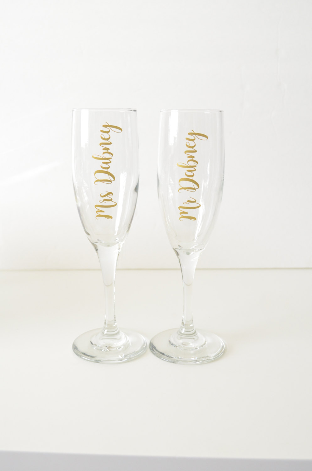 https://twistedhangers.com/wp-content/uploads/2017/03/custom-champagne-glasses-bride-toasting-glass-58cb627a1.jpg